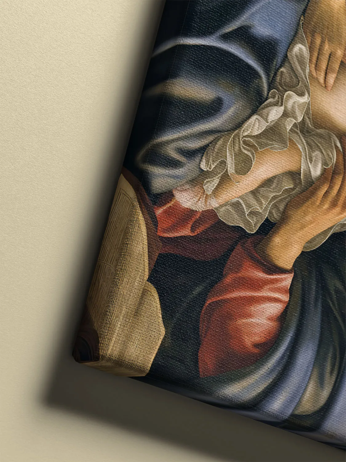 Mary in deep blue robes cradles the infant Jesus as Joseph reaches tenderly toward him, set in a warm Renaissance interior with golden halos and rich fabrics.