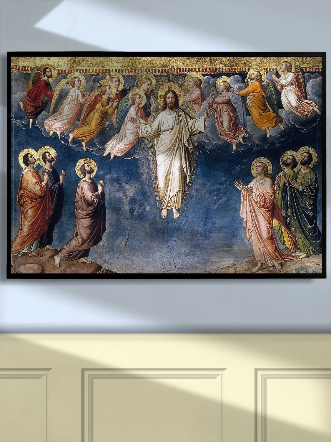 Byzantine Transfiguration icon: Christ radiant in gold mandorla, flanked by angels, with kneeling disciples below against a flat gold and blue background.