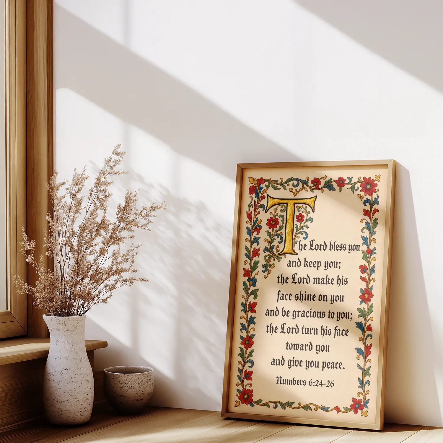 The Lord Bless You and Keep You - Numbers 6:24-26 Bible verse poster in a wood frame beside a window