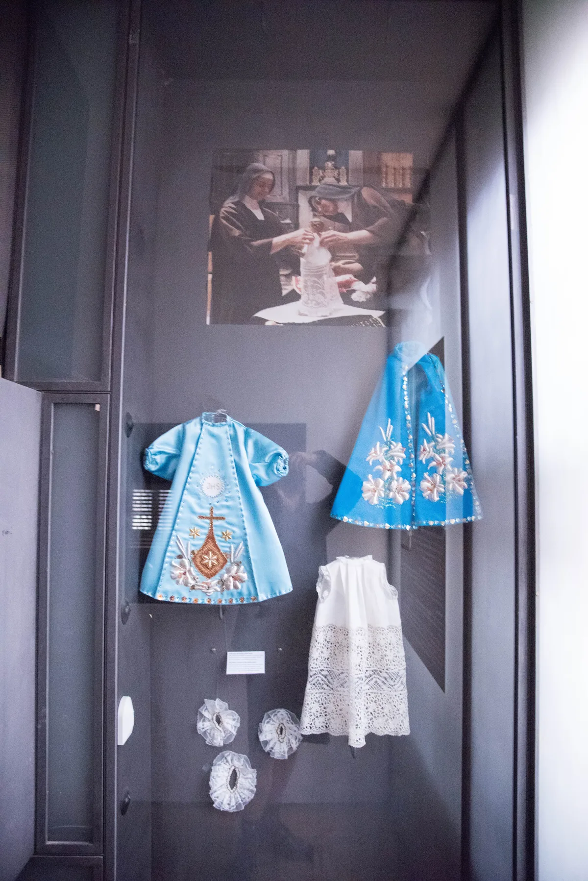 Some of the richly embroidered royal robes made for the Infant of Prague, displayed in its treasury