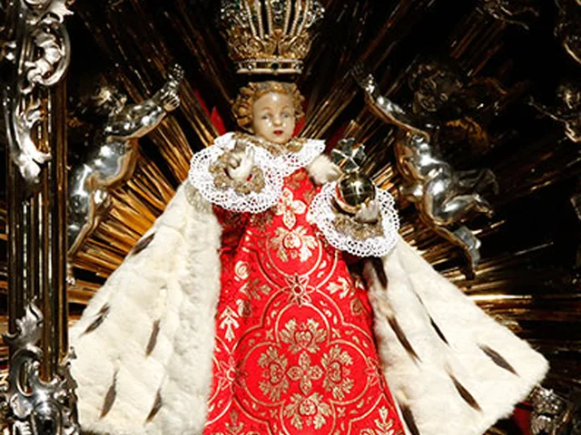 The Infant of Prague statue, the crowned Child Jesus in red and gold robes holding a globe