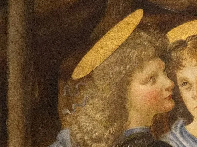 Detail of Leonardo's angel in the Baptism of Christ, the head turned in profile beneath a gold halo