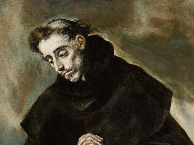 Detail of El Greco's Saint Dominic in Prayer, the friar's head bowed over joined hands in a black and white Dominican habit