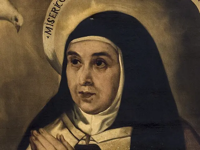 Face of Saint Teresa of Avila in the Carmelite habit, with a haloed inscription and a dove