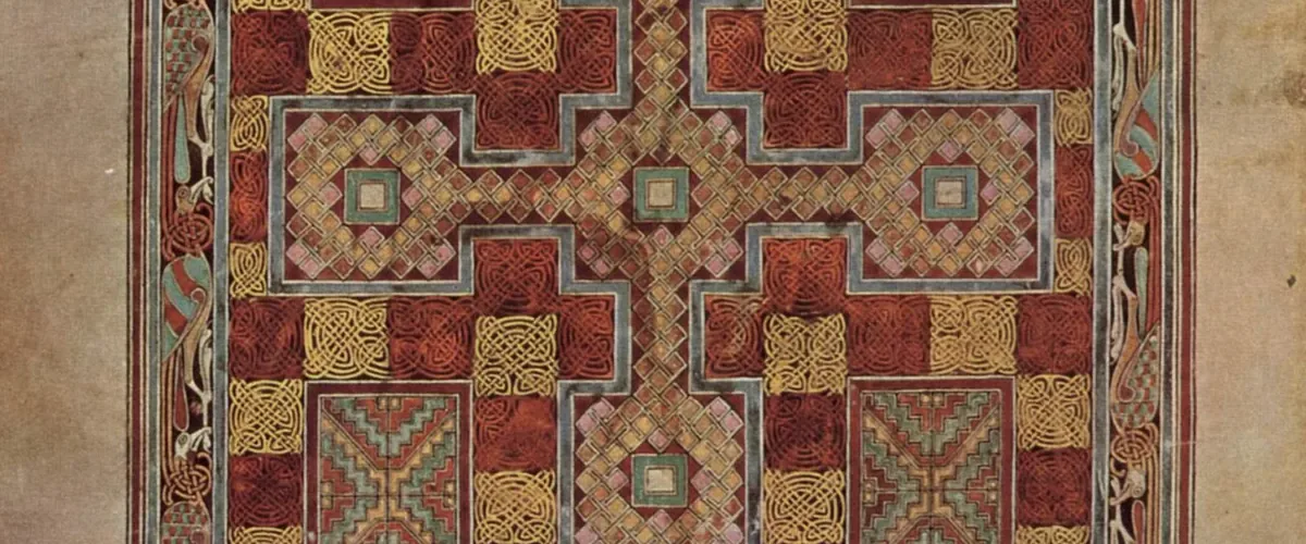 Detail of a carpet page from the Lindisfarne Gospels, a cross built entirely of knotwork in red, gold and green