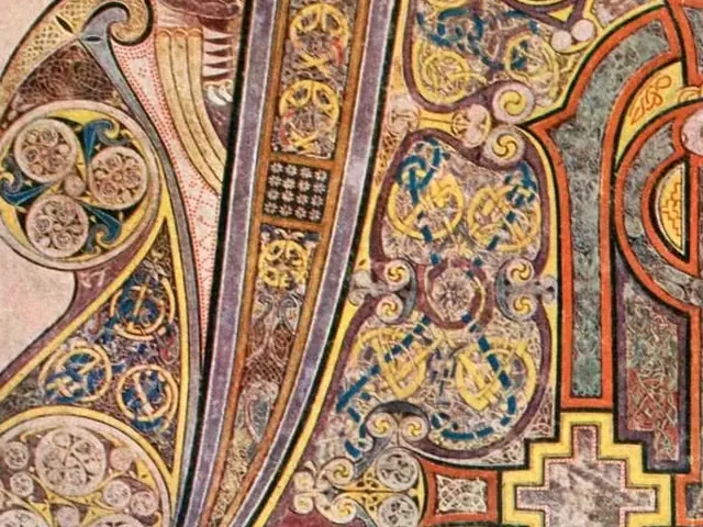 Detail of the Chi Rho page of the Book of Kells, spirals and interlace in gold, blue and red