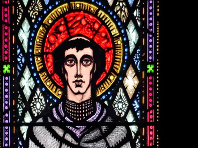 Detail of Harry Clarke's Saint Columba, a young tonsured monk under a red and gold halo