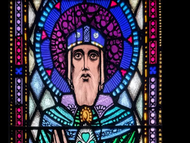 Detail of Harry Clarke's Saint Patrick, the haloed bishop's face under a blue and silver mitre against a violet halo