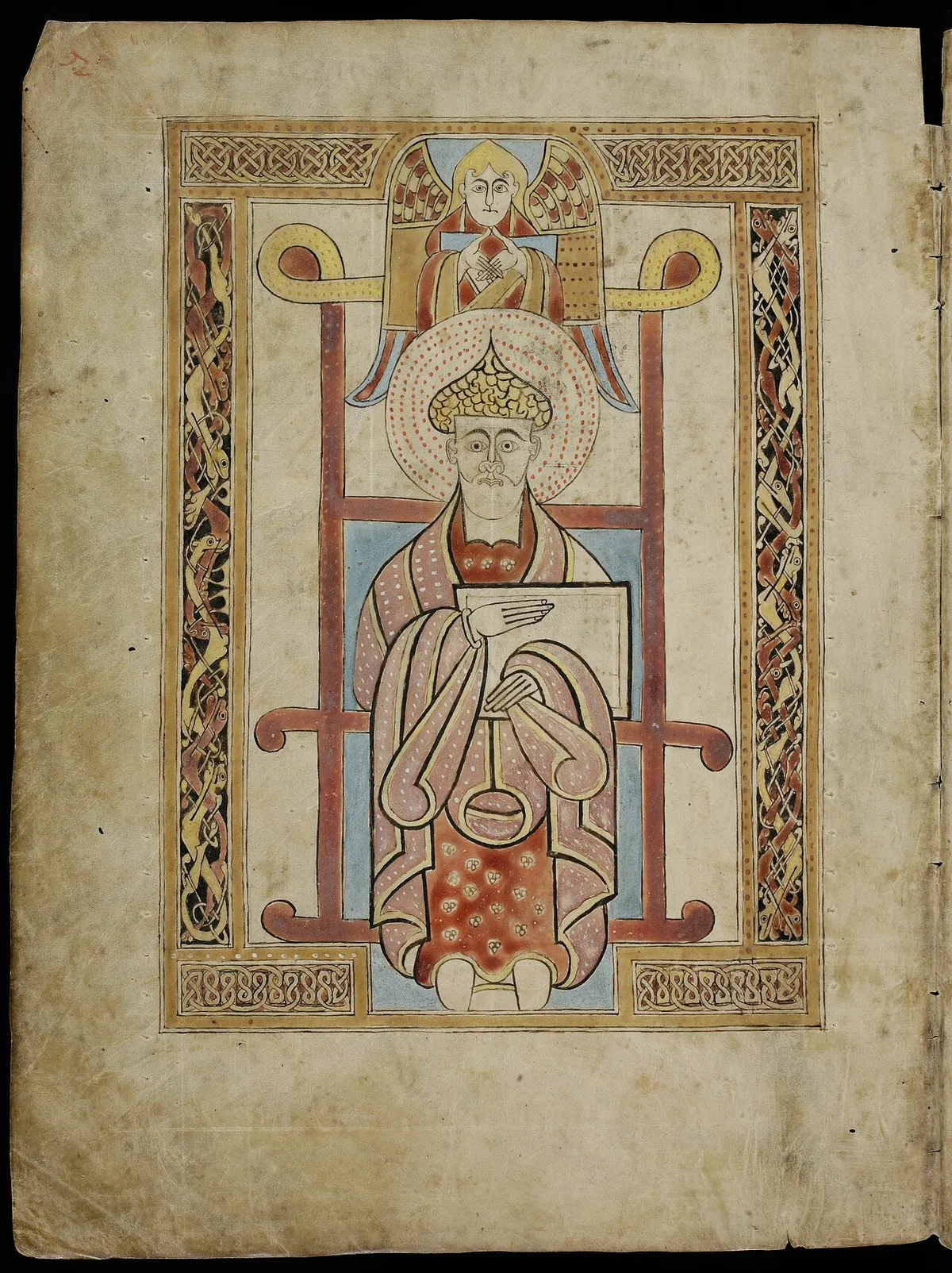 Insular illuminated page of the St Gall Gospels showing Saint Matthew frontally with a book, framed by interlace ornament