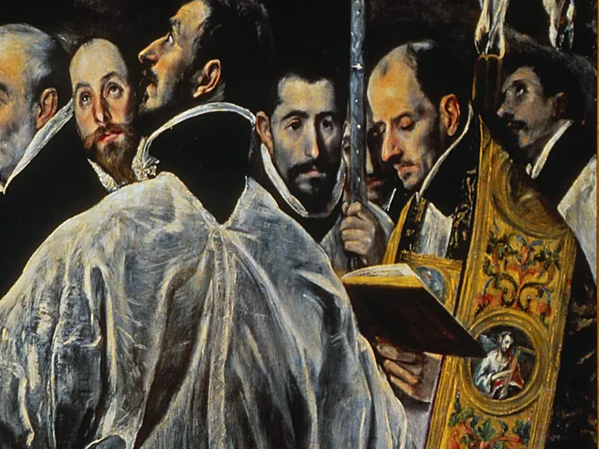 Close-up of the parish priest Andres Nunez reading from a book beside the processional cross, with clerics in black