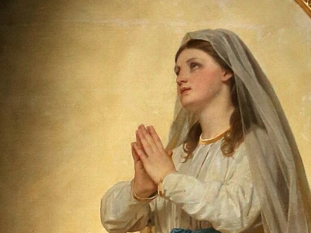 The Virgin of Lourdes in white with a blue sash, hands joined in prayer, detail of a painting by Antonio Ciseri