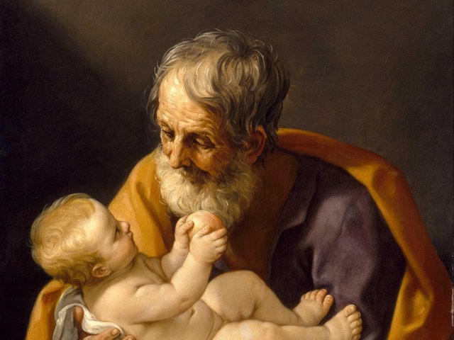 Saint Joseph, an old man with a white beard, holding the Christ Child, who reaches up toward his face, detail of a painting by Guido Reni