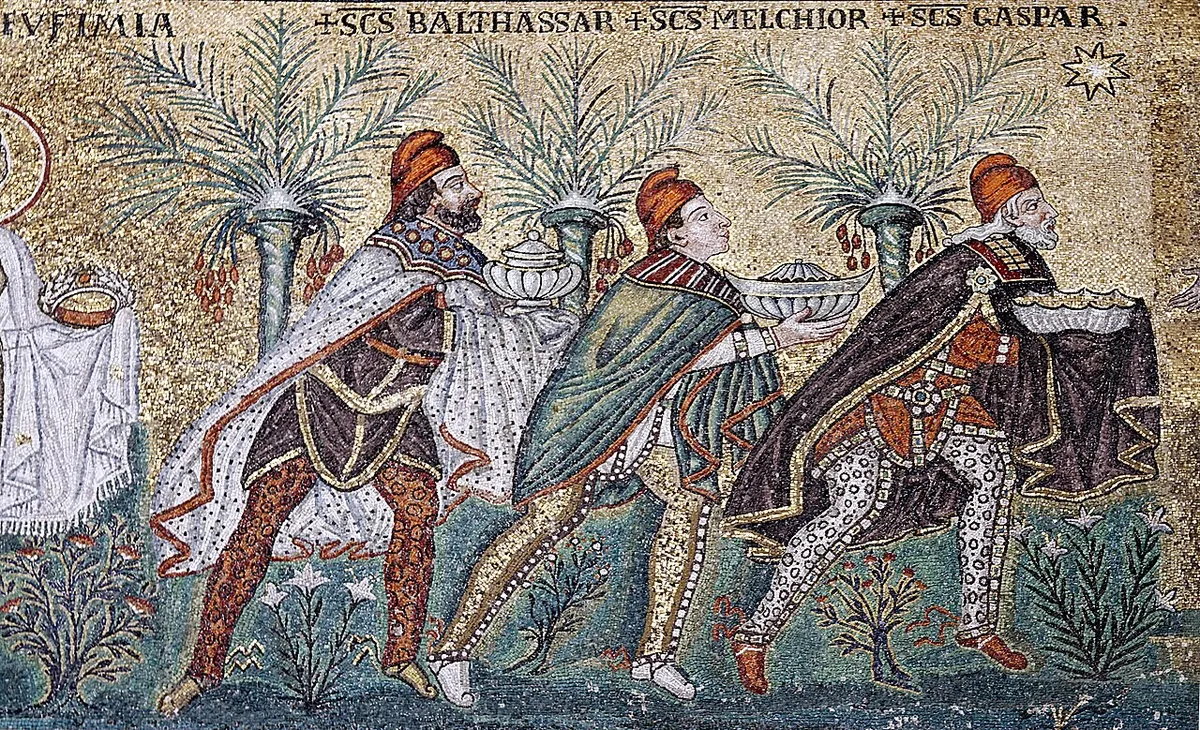 Sixth-century mosaic of the three Magi in Persian dress and red caps carrying their gifts, with their names Balthassar, Melchior and Gaspar written above their heads on a gold ground